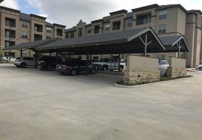Metal carport installation at multi-family apartment complex