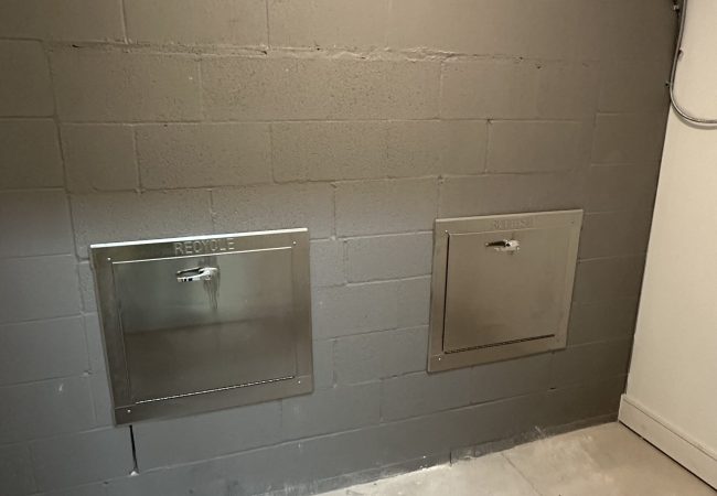 Stainless steel trash chute room with dual access doors