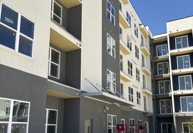 Exterior of new apartment complex with awning installation